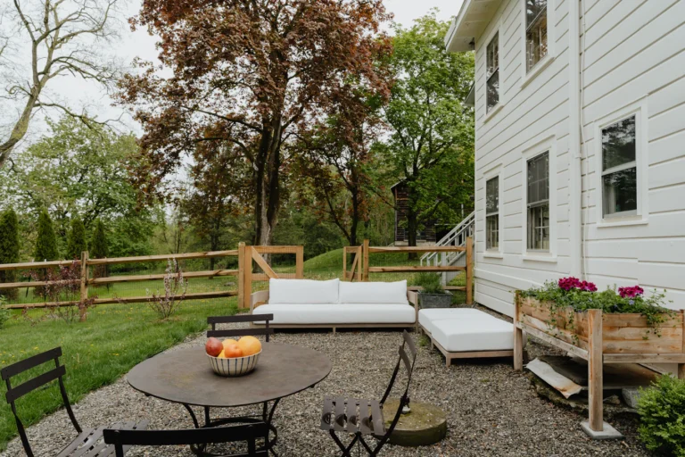 Backyard patio with outdoor sofa and dining area