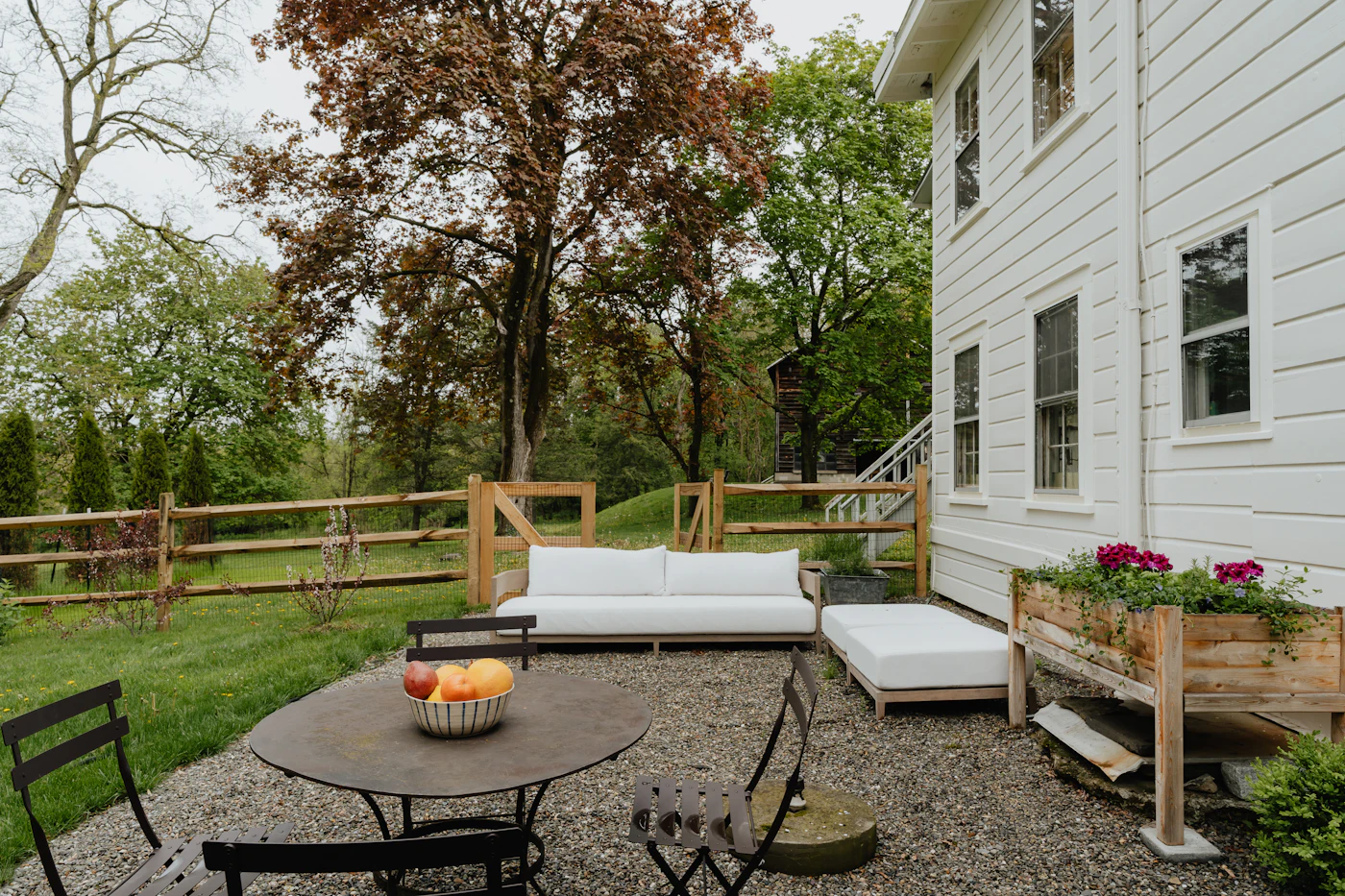 Backyard patio with outdoor sofa and dining area